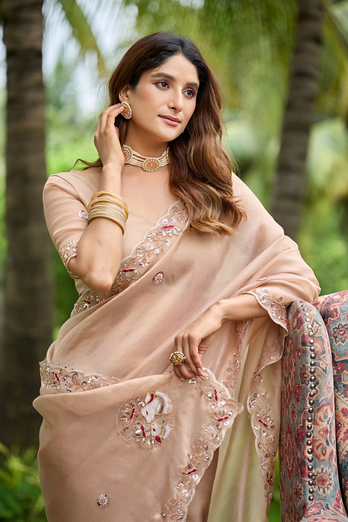 Close up of light chicku sequin floral embroidered tissue silk saree pallu with floral sequin work — Chandrikas
