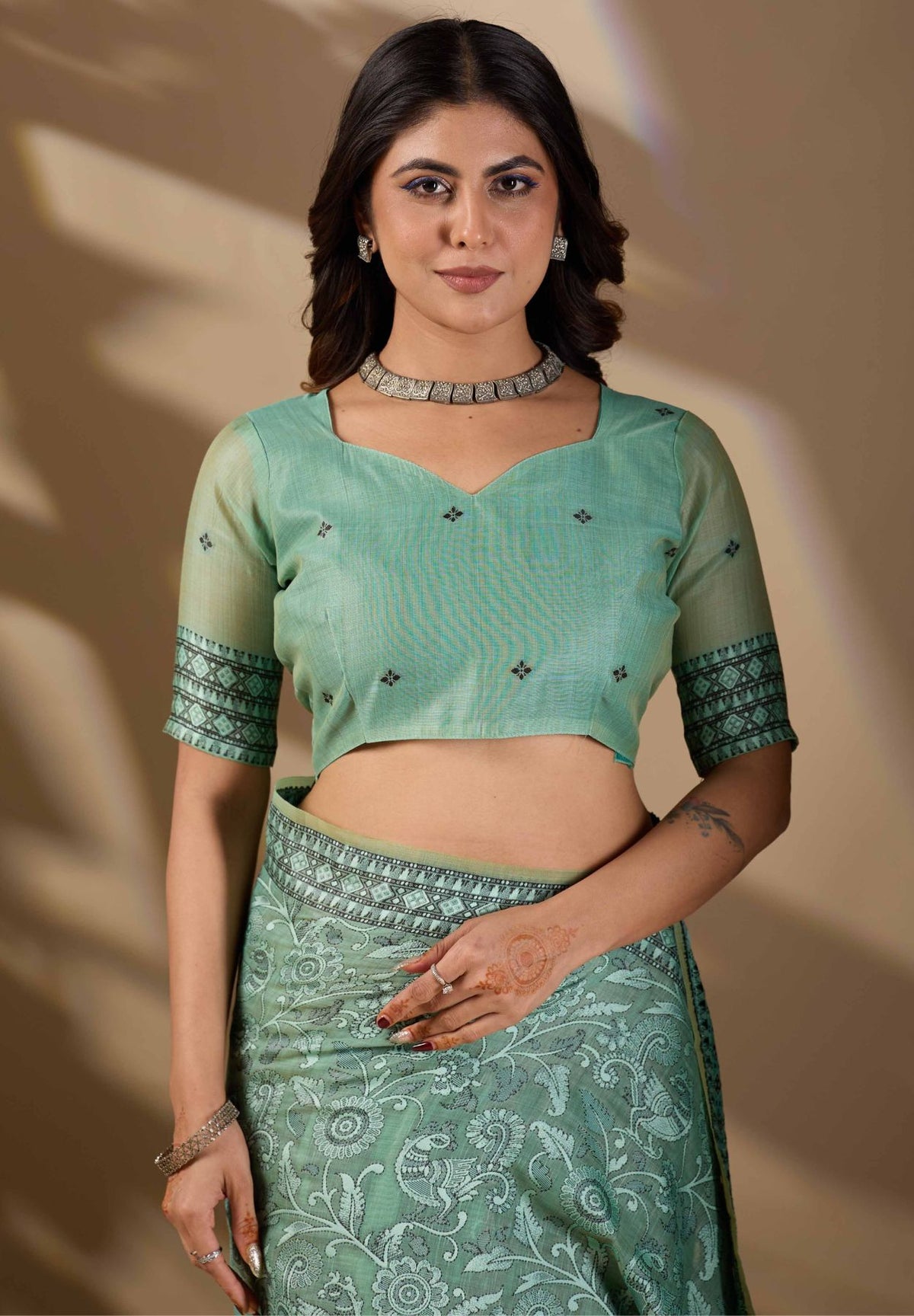 Woman in close pose wearing mint green Banarasi cotton jacquard jaal saree — Chandrikas