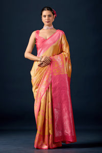 Woman in front pose wearing mustard gold dark pink leaf motif zari pallu silk saree — Chandrikas