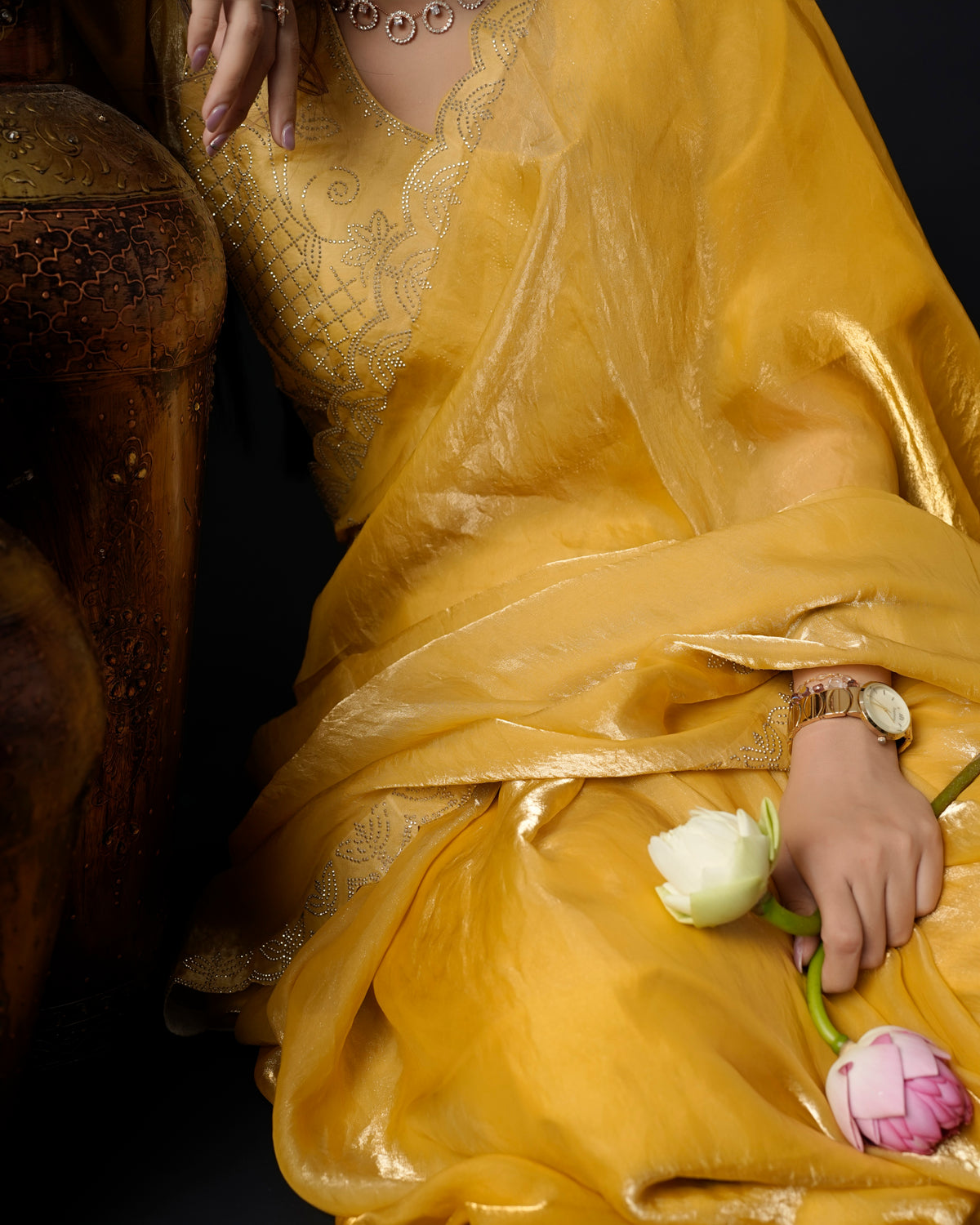 Close-up of mustard yellow tissue crepe silk saree showing scalloped stone embroidery border — Chandrikas