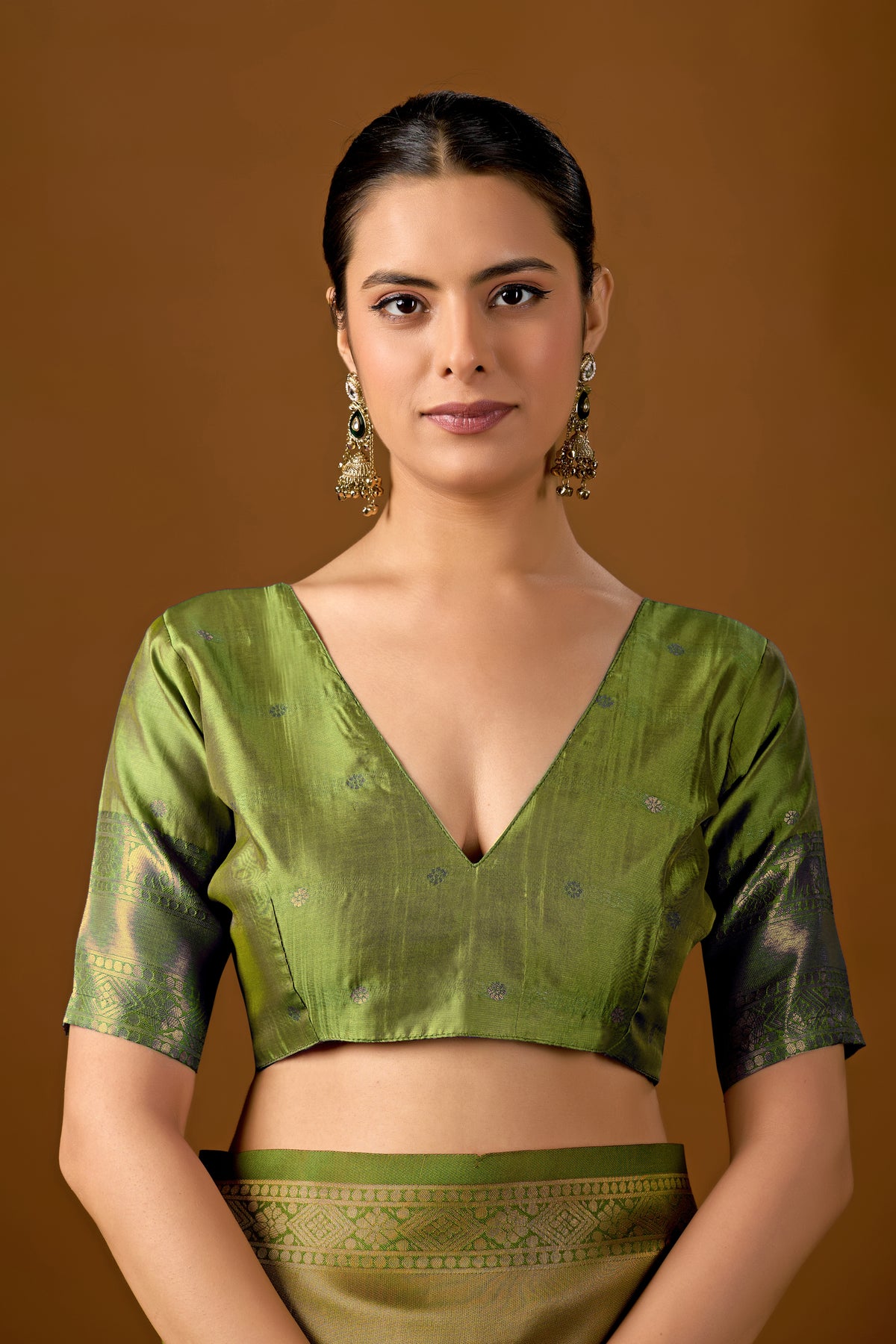 Woman in close pose wearing pastel pink olive green Banarasi silk checks pattern saree — Chandrikas