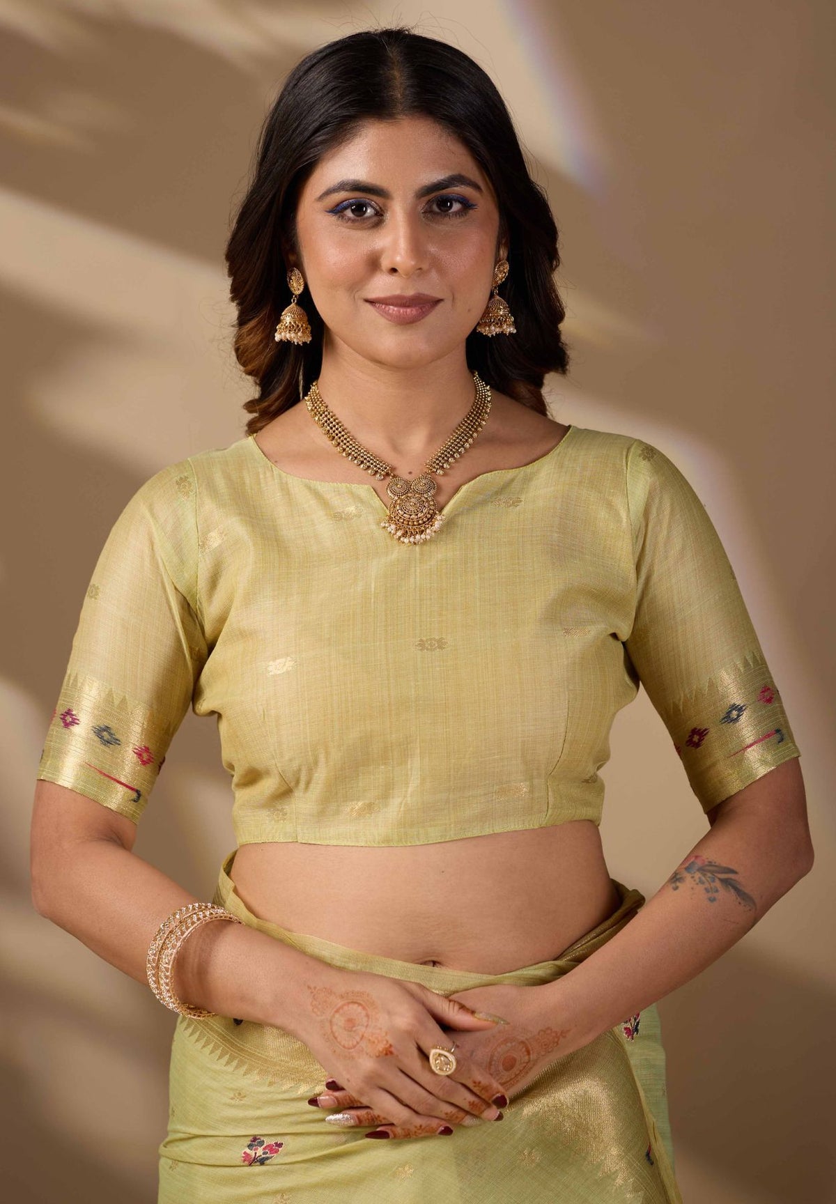 Woman in close pose wearing sea green Banarasi-Paithani zari pallu cotton saree — Chandrika