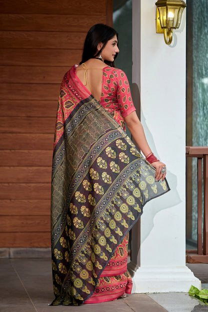 Woman in side pose wearing coral red leaf print cotton saree with grey border — Chandrikas