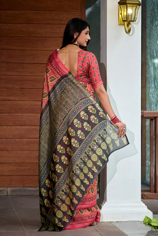 Woman in side pose wearing coral red leaf print cotton saree with grey border — Chandrikas