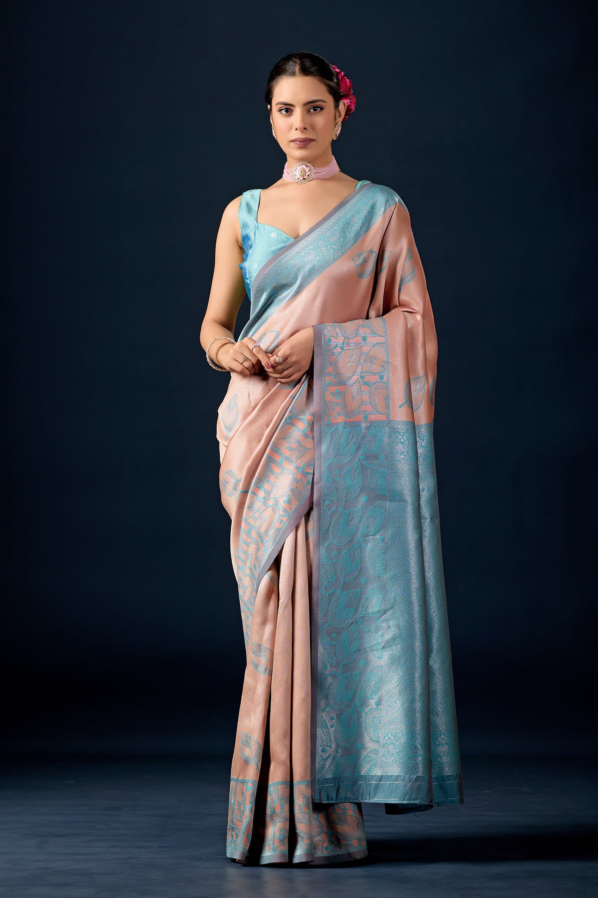 Woman in front pose wearing beige cream teal leaf motif zari pallu silk saree — Chandrikas