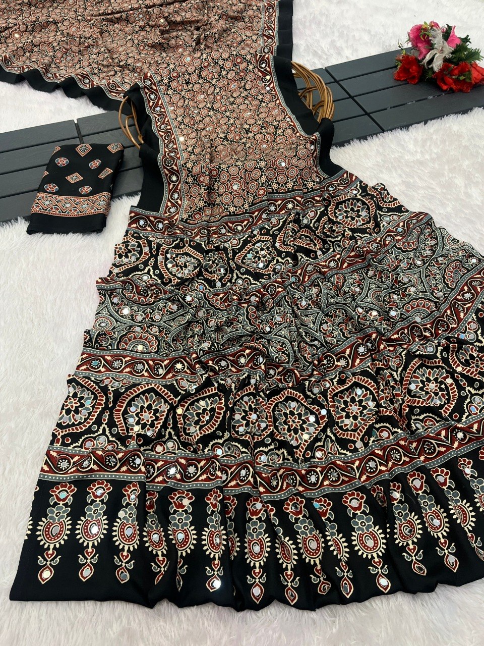 Black Ajrakh print Italian crepe saree with mirror work and floral border, matching blouse piece — Chandrikas