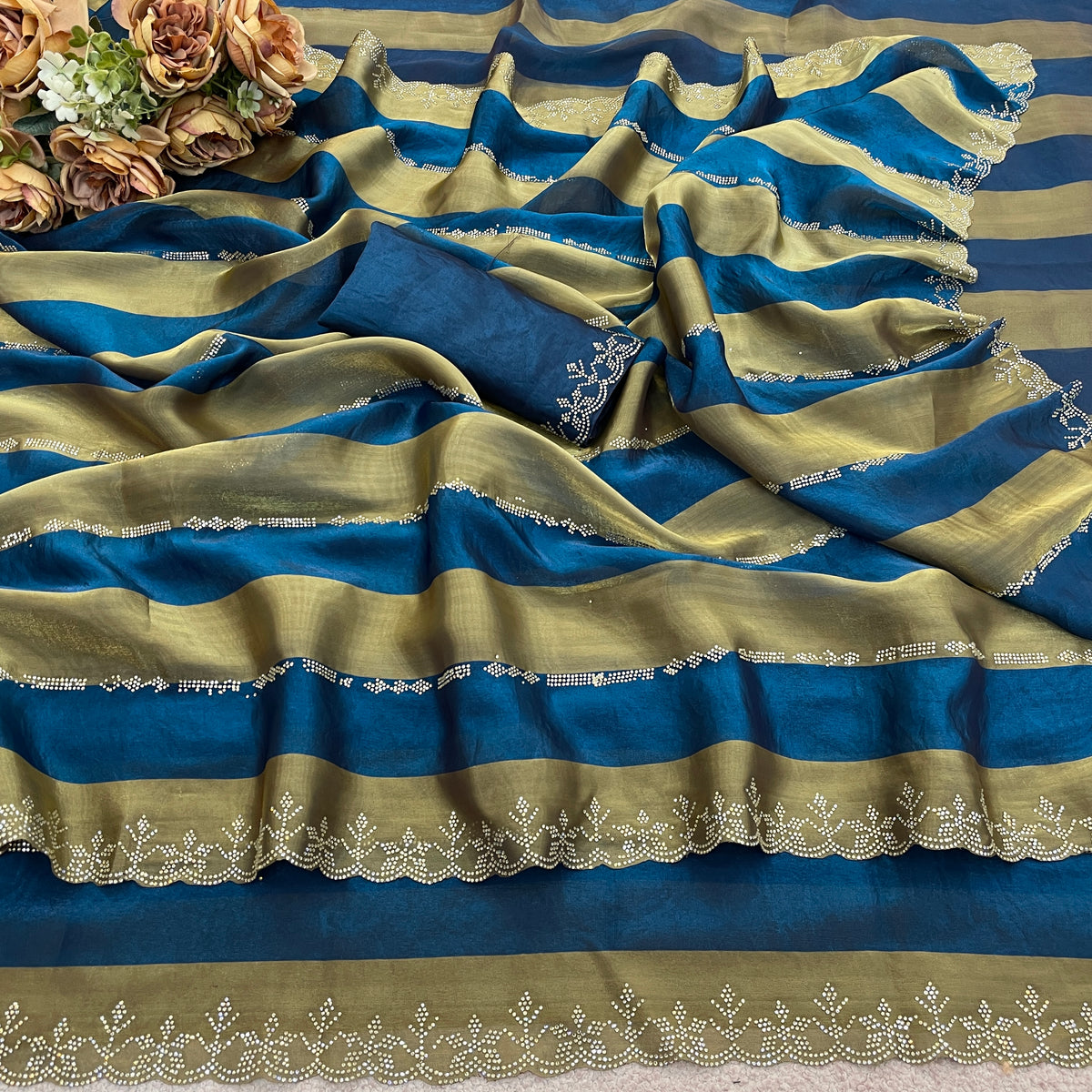 Cobalt blue striped satin patta saree flatlay with golden border and embellished edge — Chandrikas