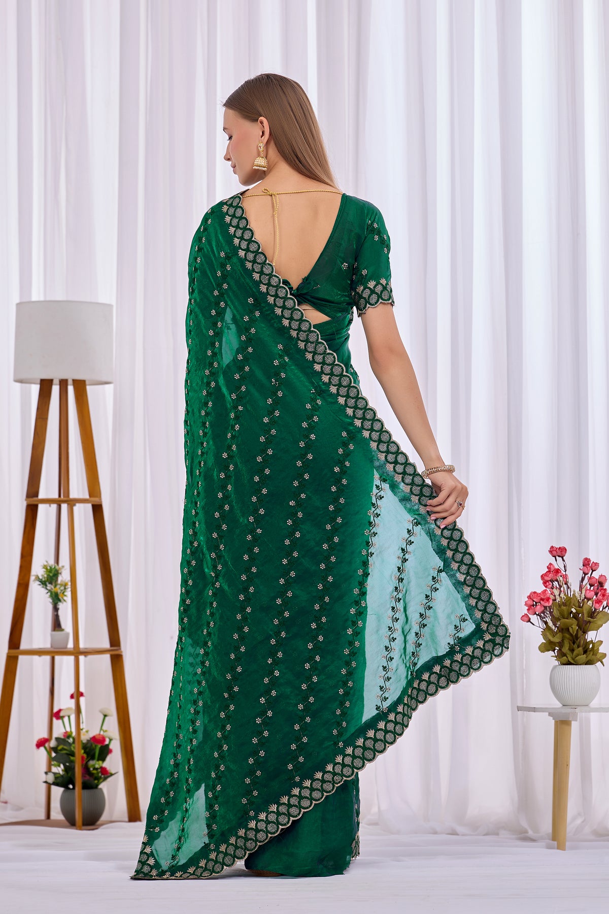 Back view of Bottle Green satin floral thread work designer border saree with pallu and blouse — Chandrikas
