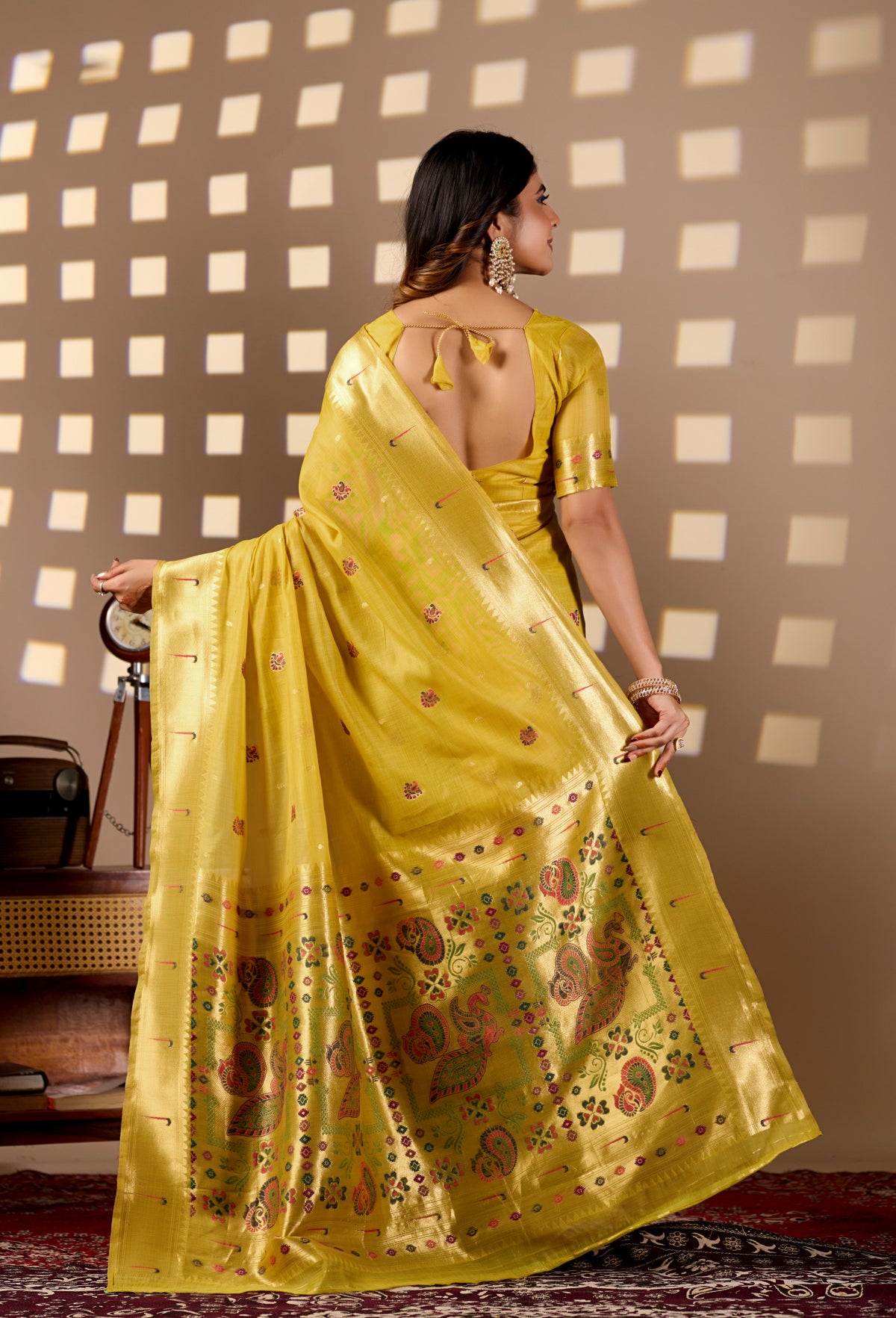 Woman in walking pose wearing bright yellow Banarasi-Paithani Meenakari cotton saree — Chandrikas