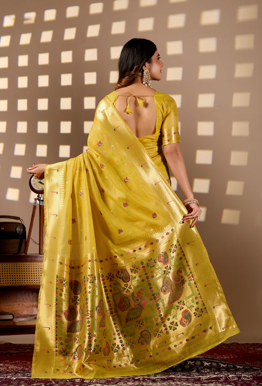 Woman in walking pose wearing bright yellow Banarasi-Paithani Meenakari cotton saree — Chandrikas
