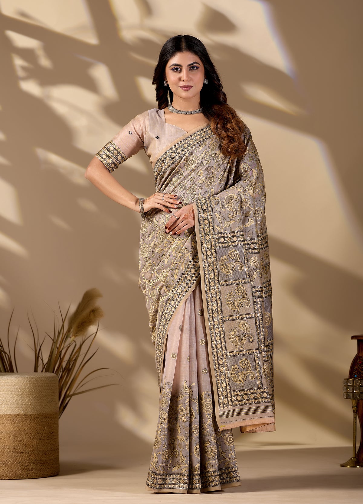 Woman in front pose wearing classic beige Banarasi cotton jacquard jaal saree — Chandrikas