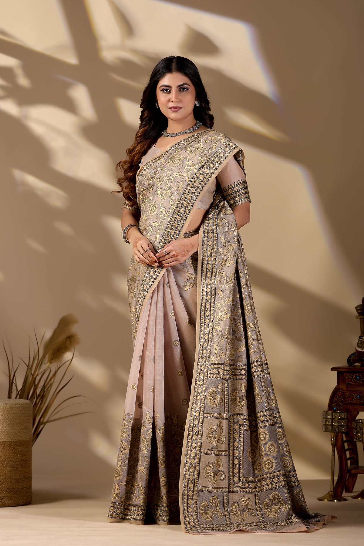 Woman in standing pose wearing classic beige Banarasi cotton jacquard jaal saree — Chandrikas
