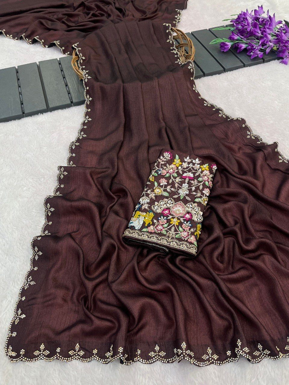 Coffee brown Tesla saree flatlay with floral embroidered border and matching blouse — Chandrikas