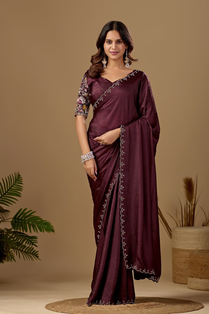 Woman wearing a coffee brown Tesla saree with floral embroidered blouse and border — Chandrikas