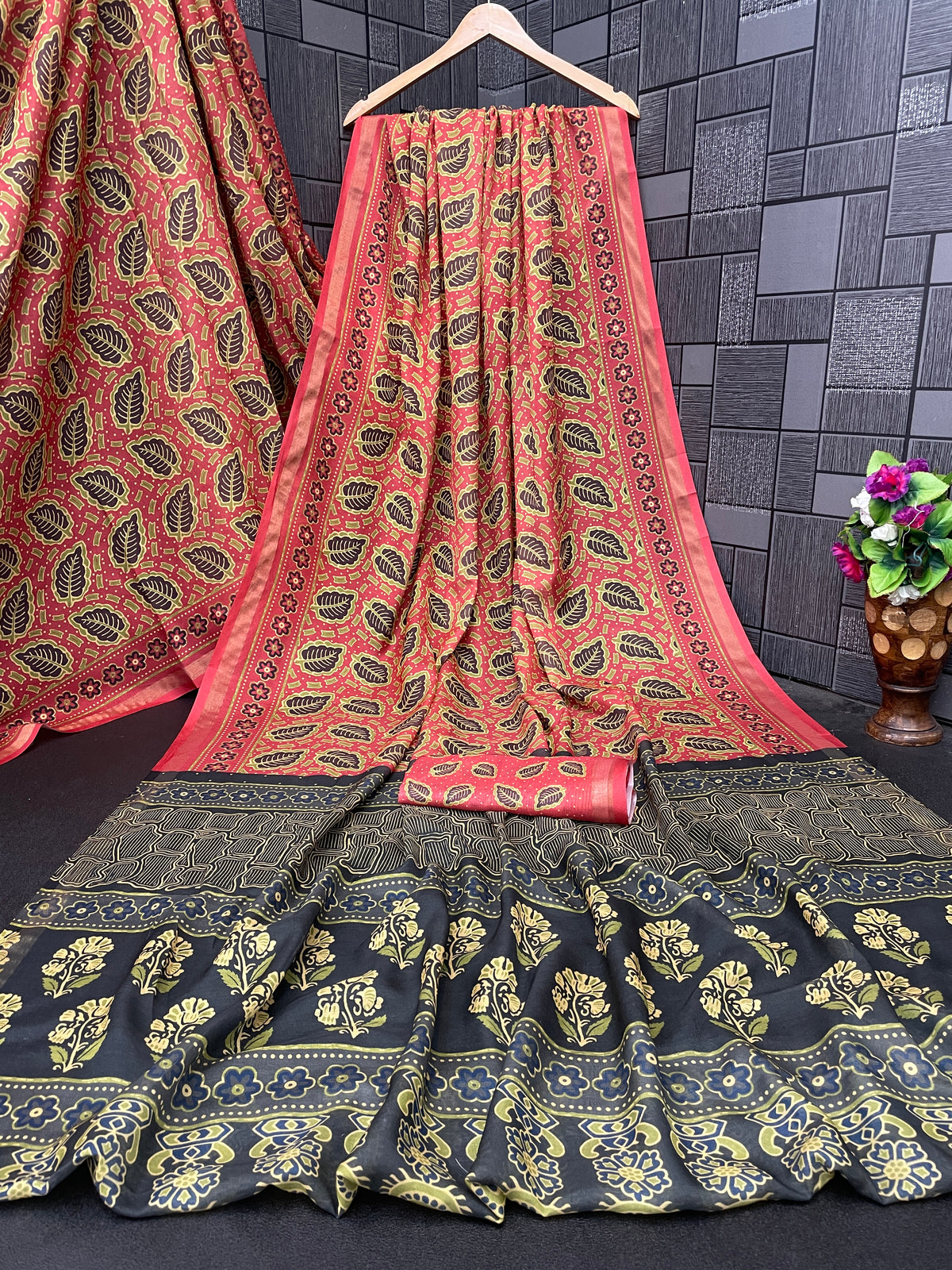 Coral red leaf print cotton saree flatlay with grey border and matching blouse — Chandrikas