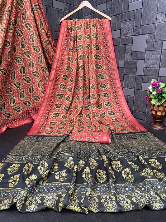Coral red leaf print cotton saree flatlay with grey border and matching blouse — Chandrikas