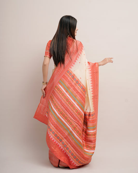 Woman in back pose showing pallu of cream coral Assam cotton silk saree with temple border — Chandrikas