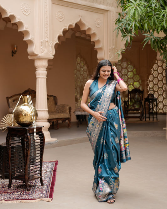 Woman walking in deep teal blue Meenakari deer motif zari pallu silk saree — Chandrikas