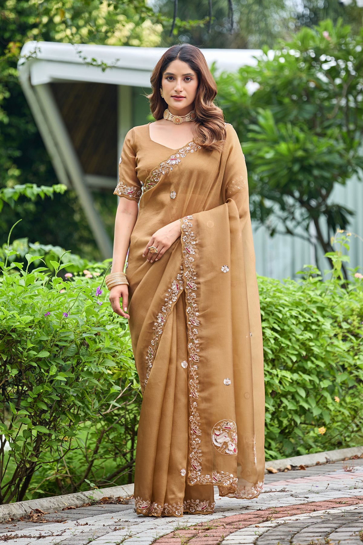 Woman standing in front pose wearing dusty gold sequin floral embroidered tissue silk saree — Chandrikas