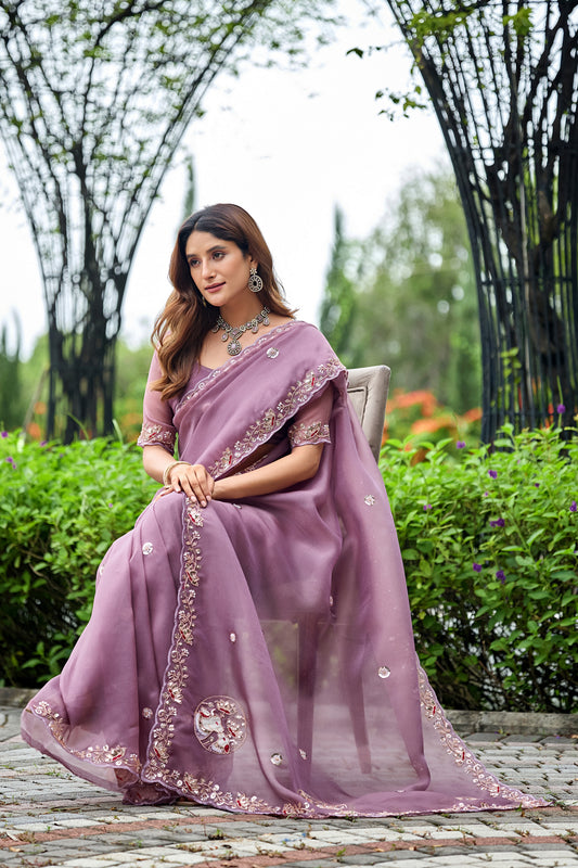 Woman in sitting pose wearing dusty lavender sequin floral embroidered tissue silk saree — Chandrikas