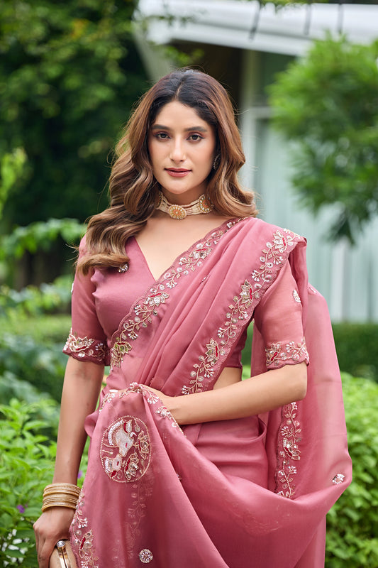 Woman in sitting pose wearing dusty pink sequin floral embroidered tissue silk saree — Chandrikas