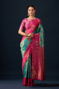 Woman in front pose wearing emerald green maroon silk matka motif border saree — Chandrikas