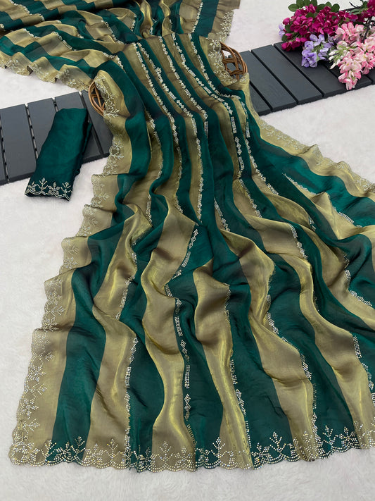 Closeup of emerald green striped satin patta saree flatlay showing golden border detail — Chandrikas