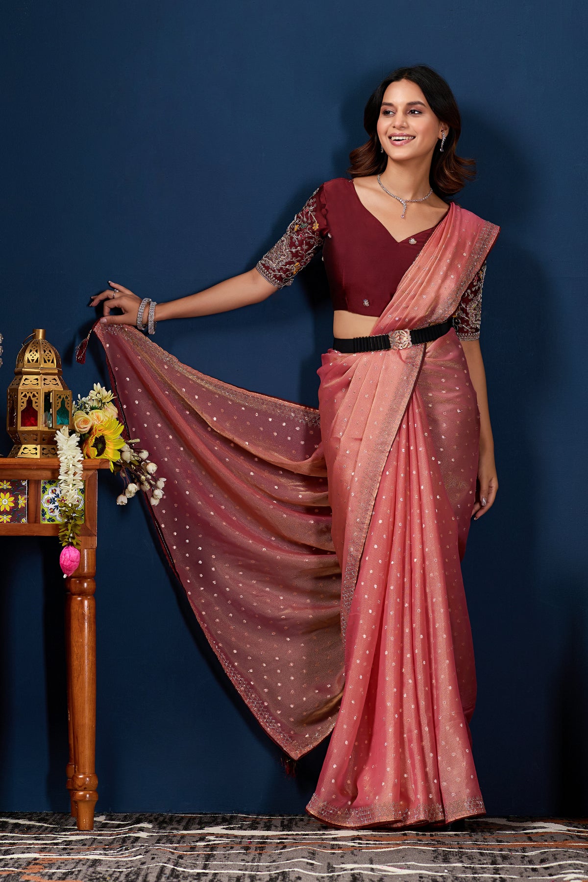 Model holding the pallu of Gajri shimmer work designer border NC Moss saree to show shimmer work — Chandrikas