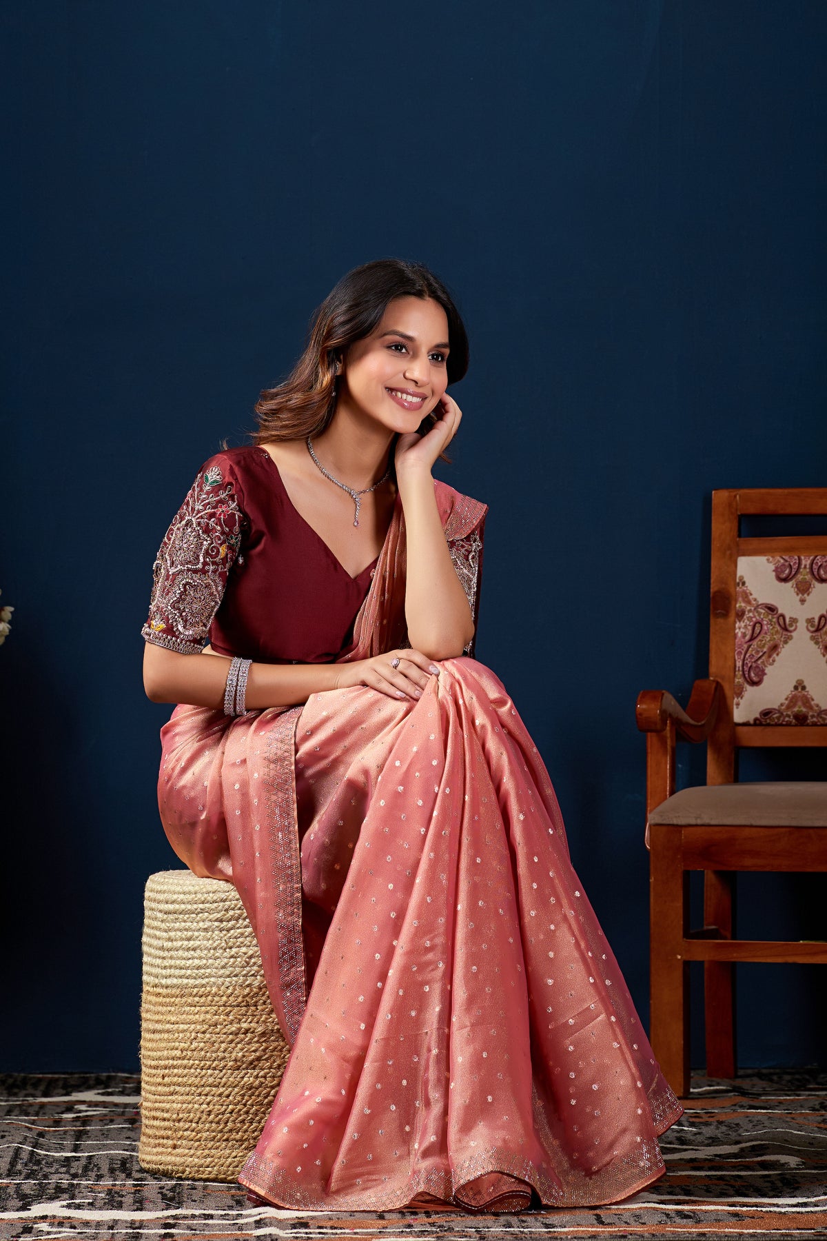 Seated pose showing flowing drape of Gajri shimmer work designer border NC Moss saree — Chandrikas