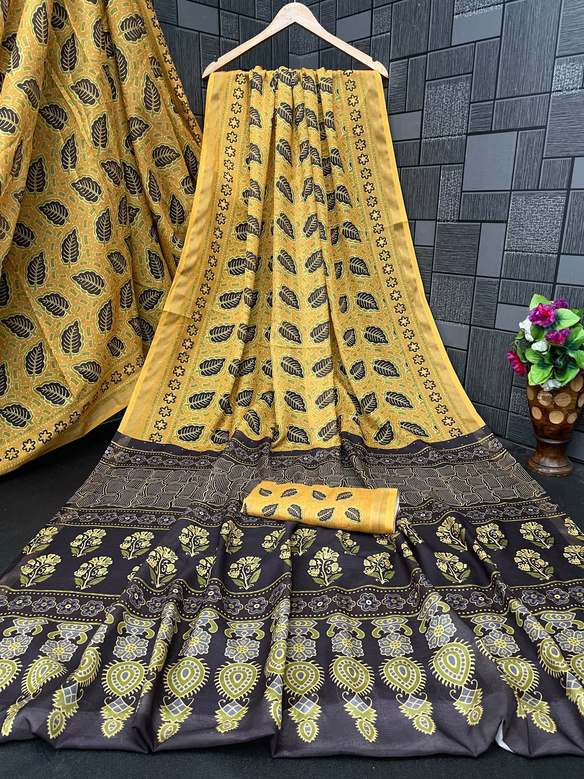 Golden mustard leaf print cotton saree flatlay with brown border and matching blouse — Chandrikas