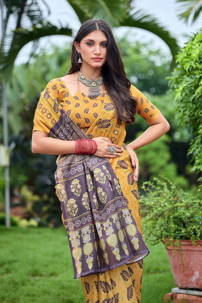 Woman in close pose wearing golden mustard leaf print cotton saree with brown border — Chandrikas
