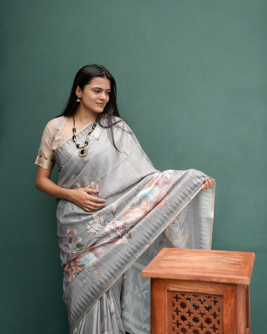 Woman in side pose wearing grey woven lotus floral digital print cotton saree — Chandrikas