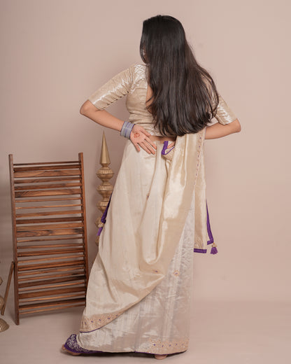 Woman in back pose wearing ivory cream floral jaal kundan work pure tissue saree — Chandrikas