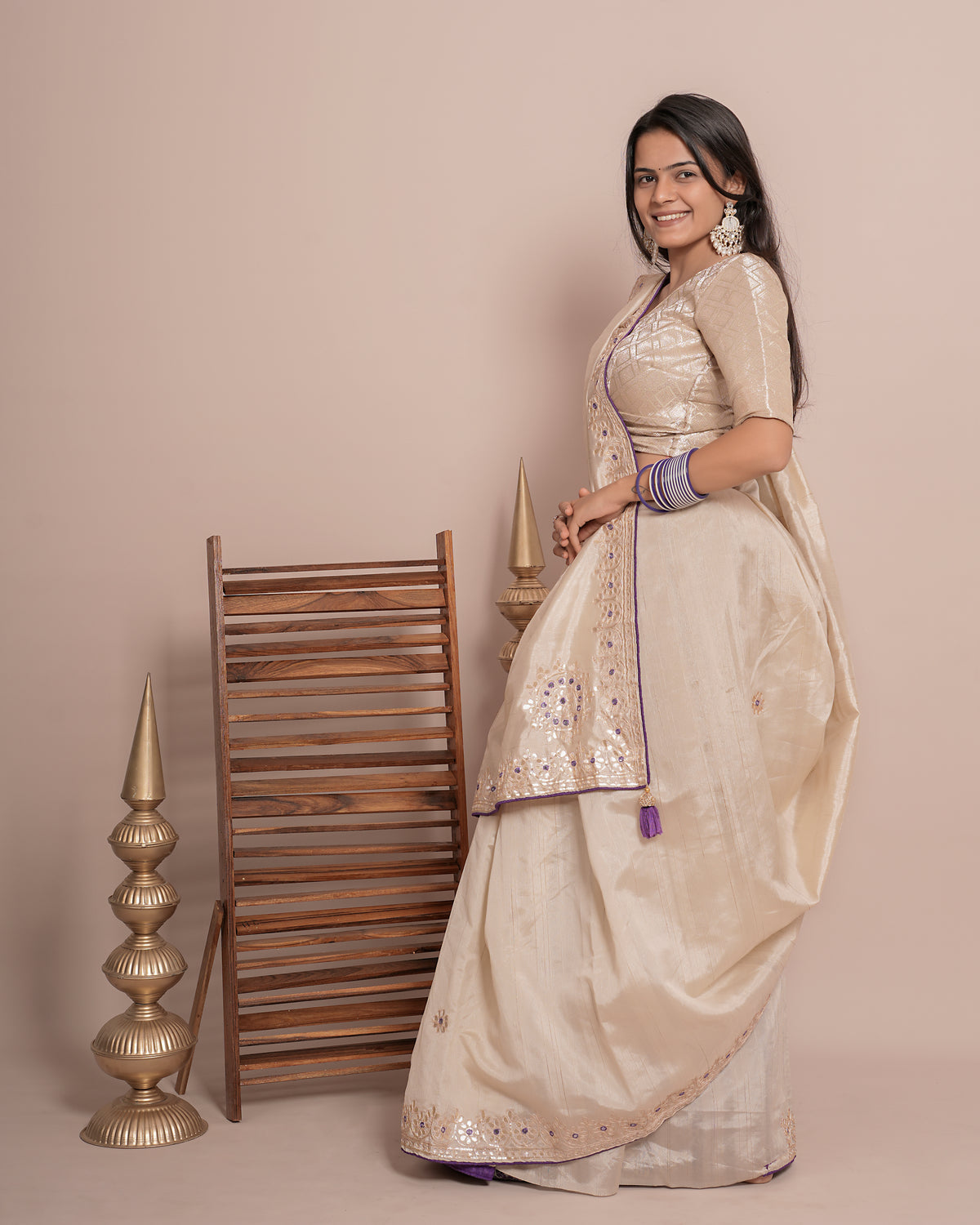 Woman in side pose wearing ivory cream floral jaal kundan work pure tissue saree — Chandrikas