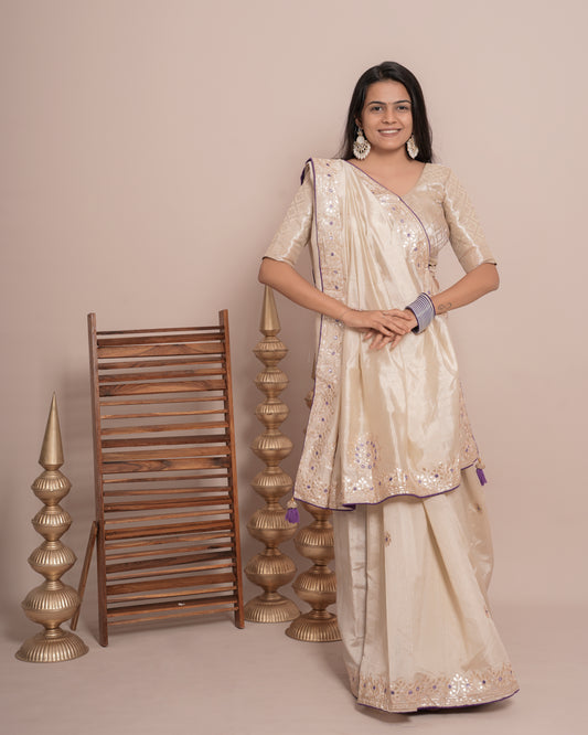 Woman in standing pose wearing ivory cream floral jaal kundan work pure tissue saree — Chandrikas