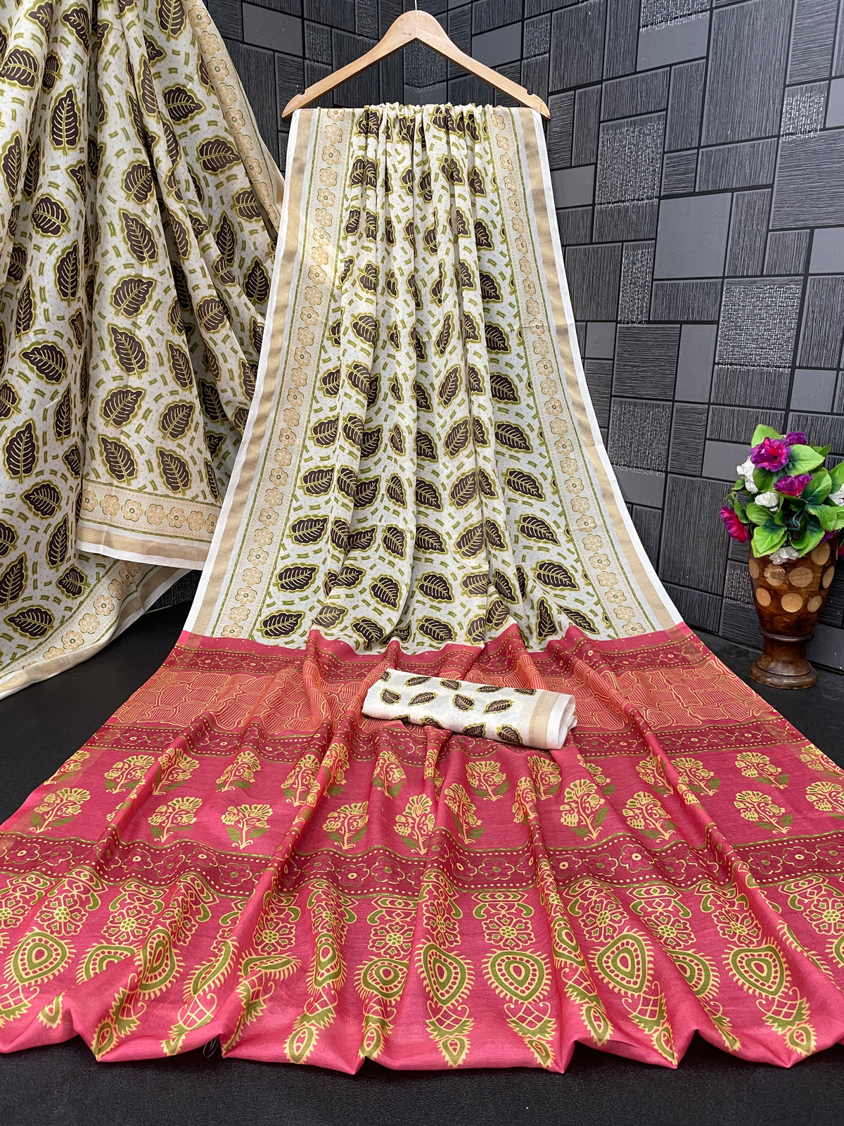 Ivory cream leaf print cotton saree flatlay with pink border and matching blouse — Chandrikas