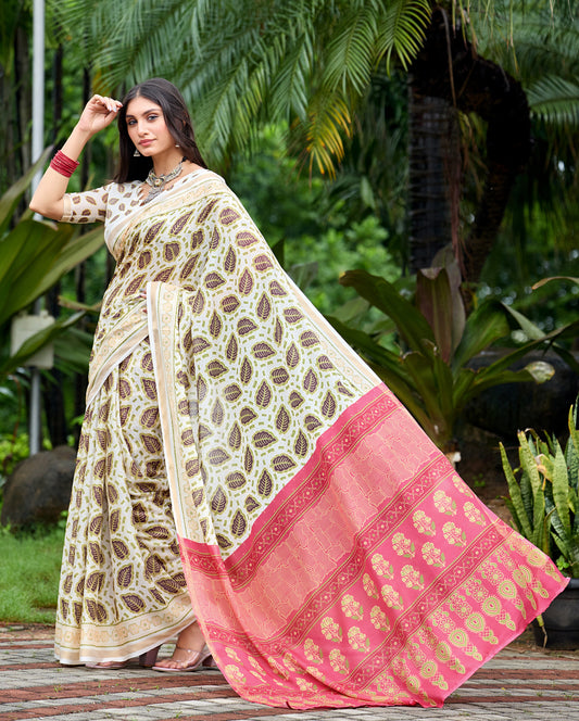 Woman in side pose wearing ivory cream leaf print cotton saree with pink border — Chandrikas