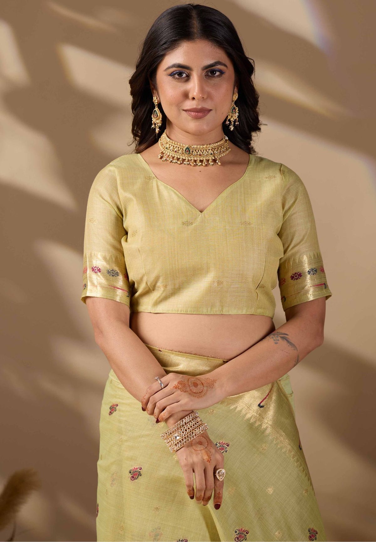 Woman in close pose wearing lemon green Banarasi-Paithani fusion cotton saree — Chandrikas