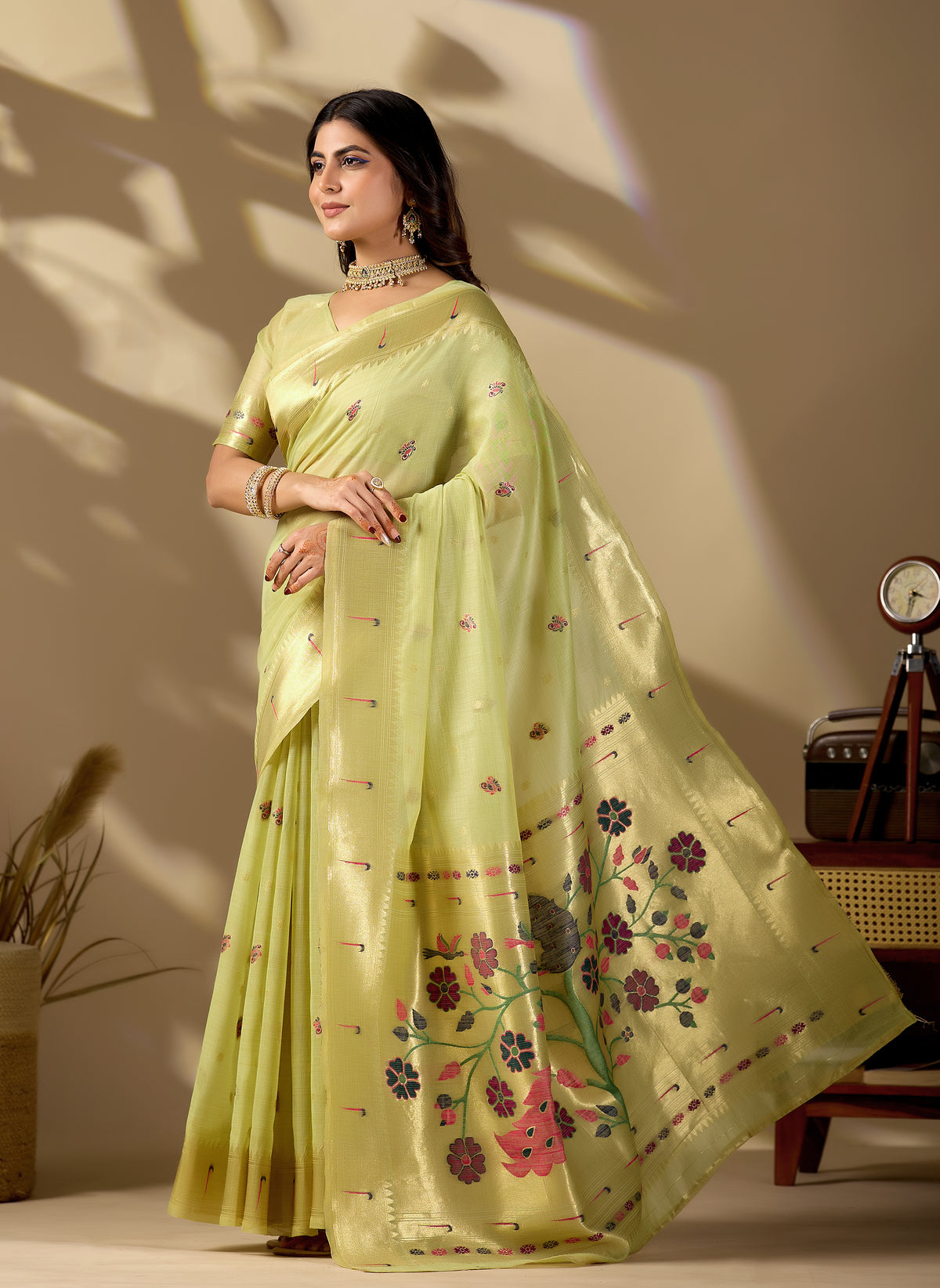 Woman in standing pose wearing lemon green Banarasi-Paithani fusion cotton saree — Chandrikas