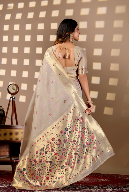 Woman draping light beige Banarasi-Paithani Meenakari cotton zari pallu saree showing peacock motif — Chandrikas