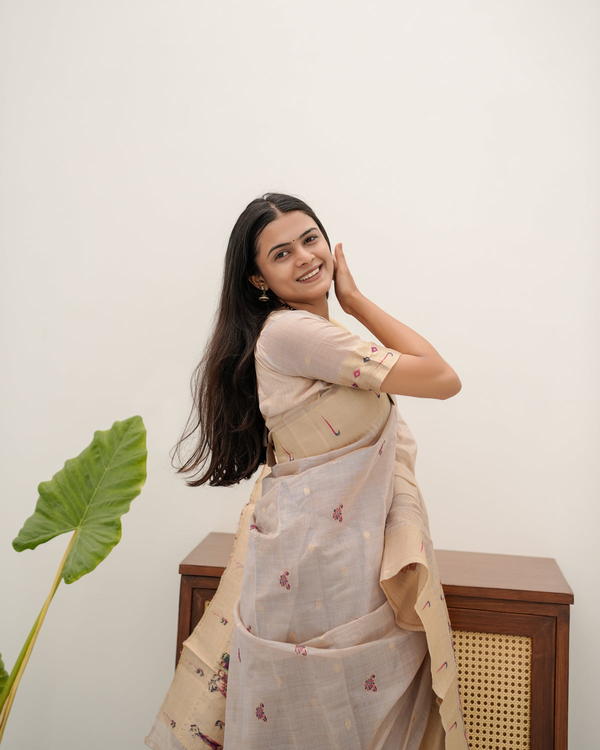 Woman in close pose wearing light beige Banarasi-Paithani Meenakari cotton zari pallu saree — Chandrikas