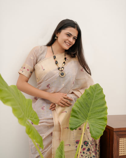 Woman in standing pose wearing light beige Banarasi-Paithani Meenakari cotton zari pallu saree — Chandrikas