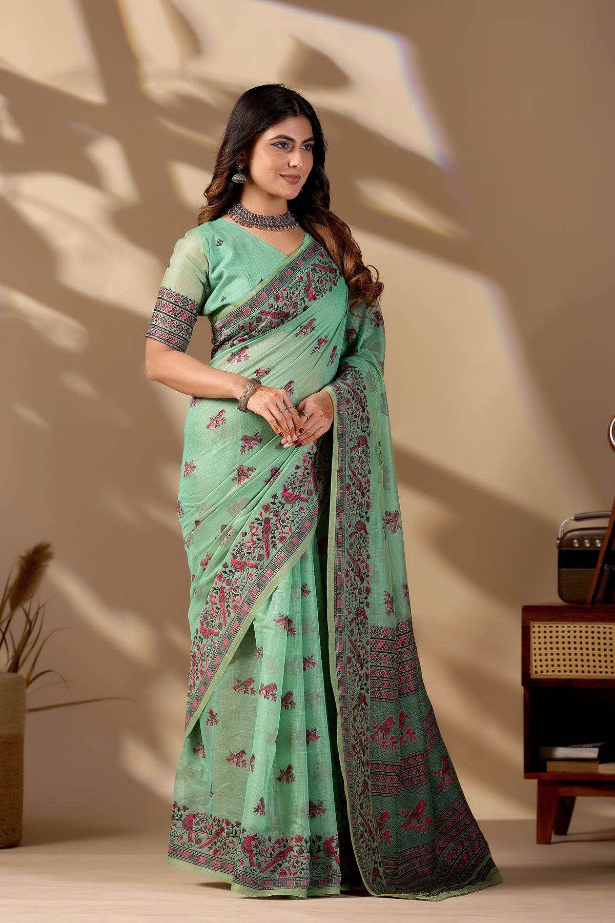 Woman in standing pose wearing light green Banarasi cotton jacquard bird buttis saree — Chandrikas