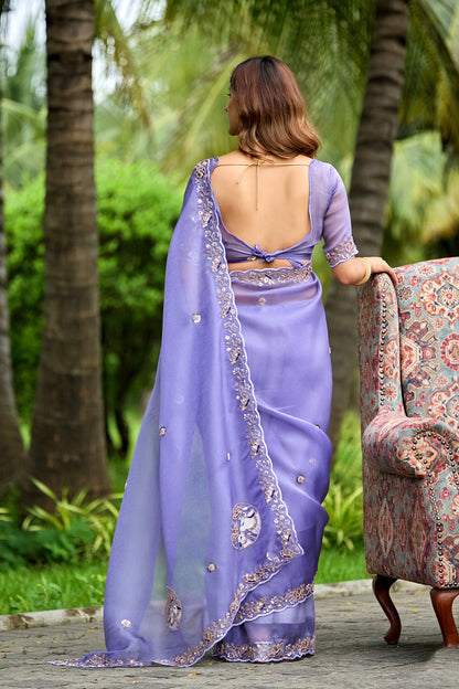 Woman in back pose wearing light lavender sequin floral embroidered tissue silk saree showing pallu — Chandrikas