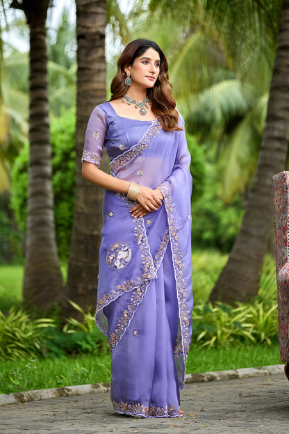 Woman in standing pose wearing light lavender sequin floral embroidered tissue silk saree with border — Chandrikas