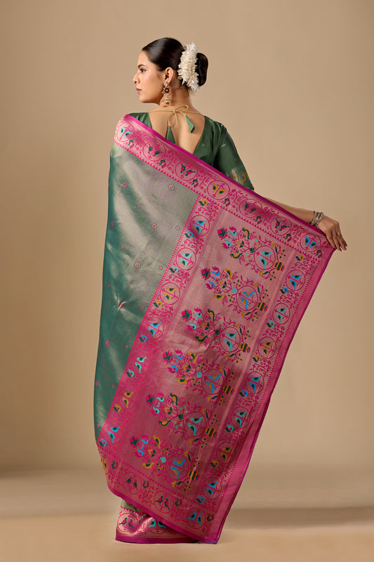 Woman draping light olive green Paithani silk bird border pallu saree showing bird motif — Chandrikas