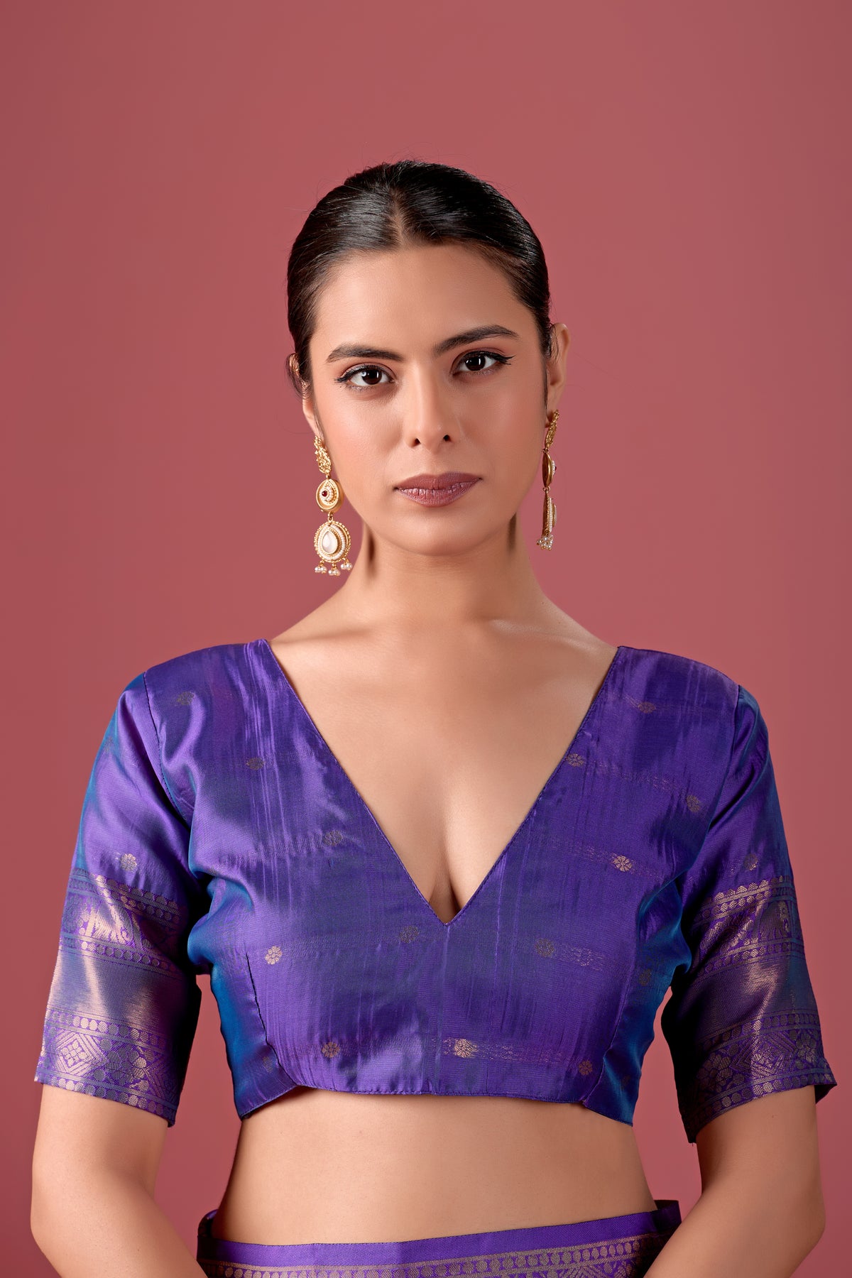 Woman in close pose wearing light purple deep purple Banarasi silk checks pattern saree — Chandrikas