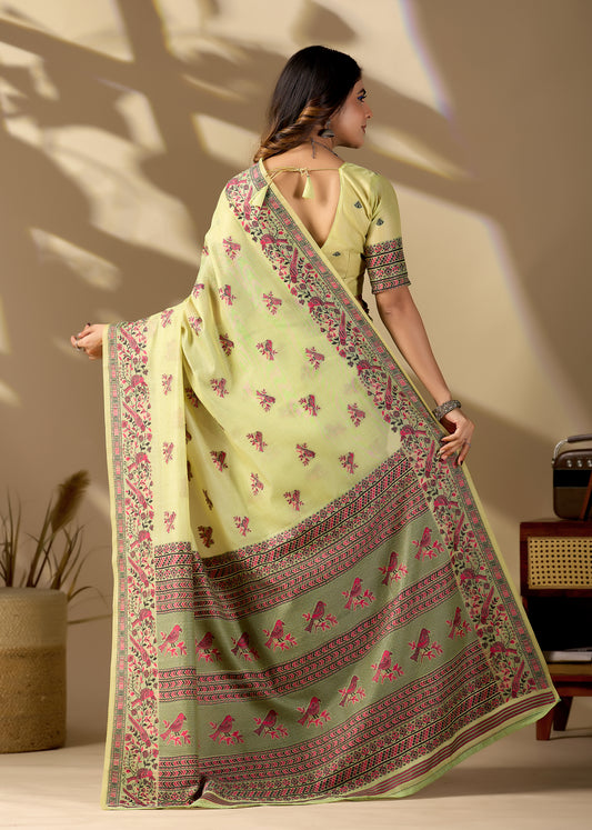 Woman draping light yellow Banarasi cotton jacquard bird buttis saree showing pallu motif — Chandrikas