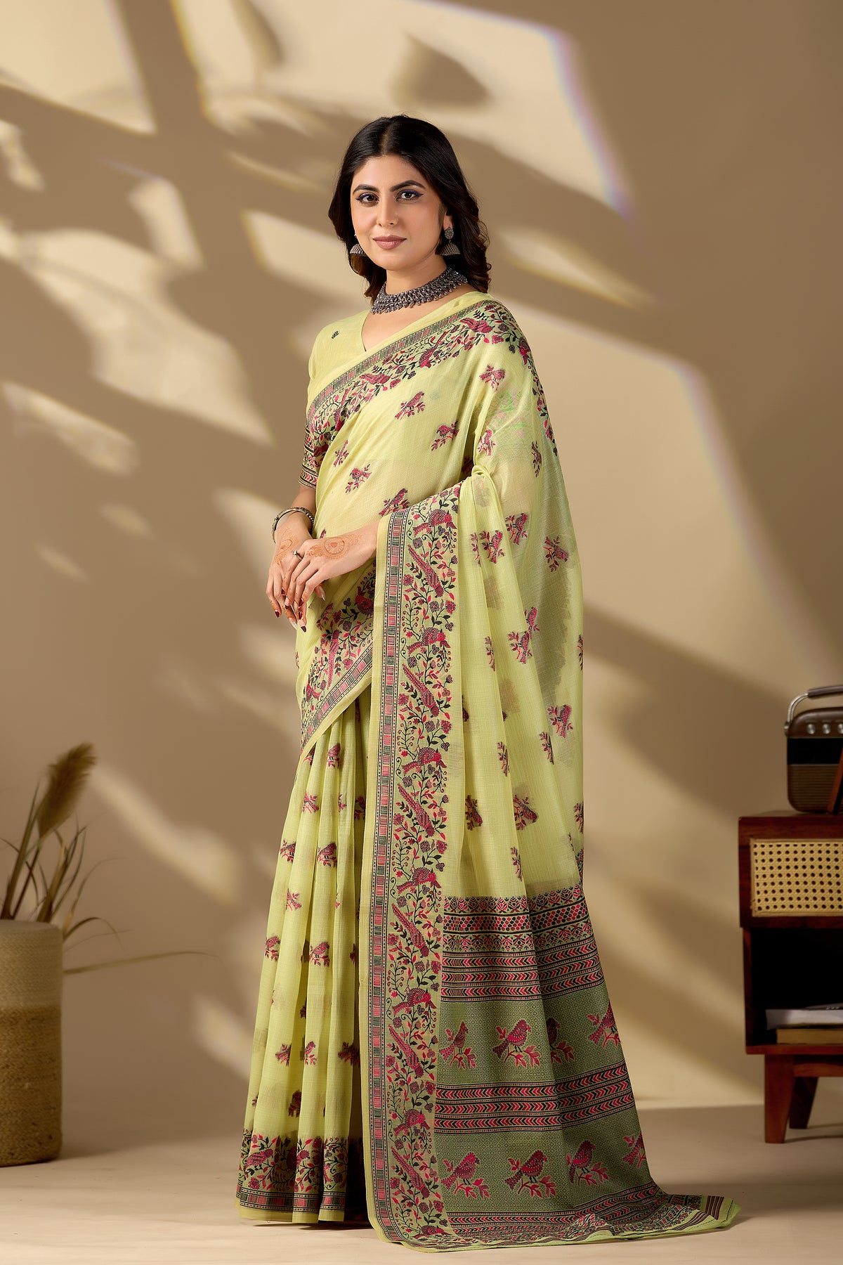 Woman in standing pose wearing light yellow Banarasi cotton jacquard bird buttis saree — Chandrikas