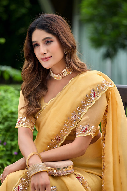 Close up of light yellow sequin floral embroidered tissue silk saree pallu with floral sequin work — Chandrikas